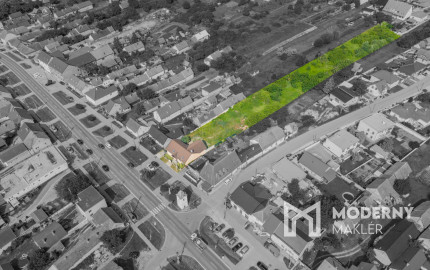 Na predaj rozsiahly investičný pozemok s polyfunkčným domom